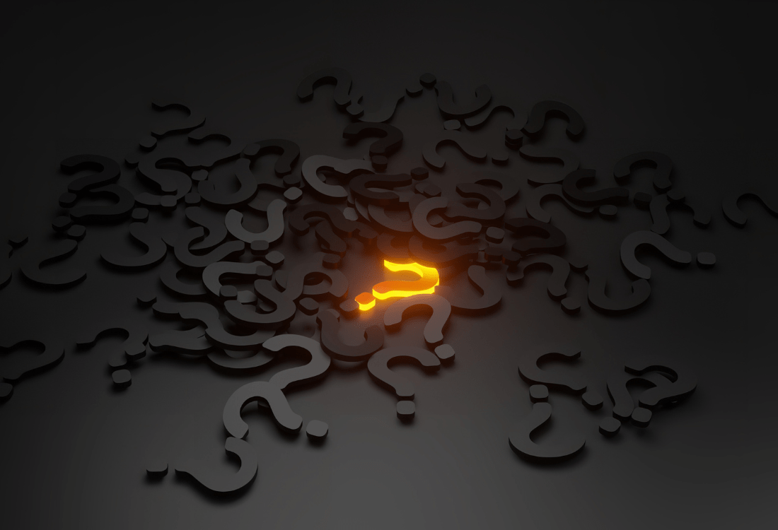 Black question marks scattered everywhere with one highlighted in yellow to signify the burning questions you should ask your next block cleaning company.