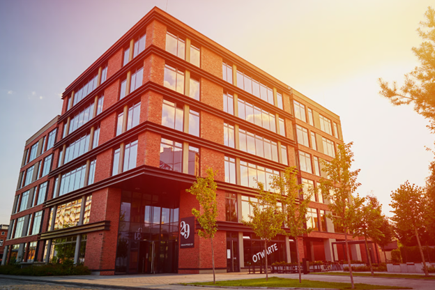 A well-kept office exterior showing the importance of investing in professional grounds maintenance rather than DIY commercial grounds maintenance.