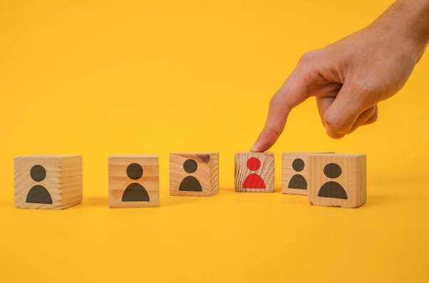 A person pointing to the perfect candidate after choosing the right office cleaning company for their business.